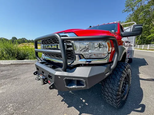 Front-right bumper close-up with guard tubing and recovery bumper details.